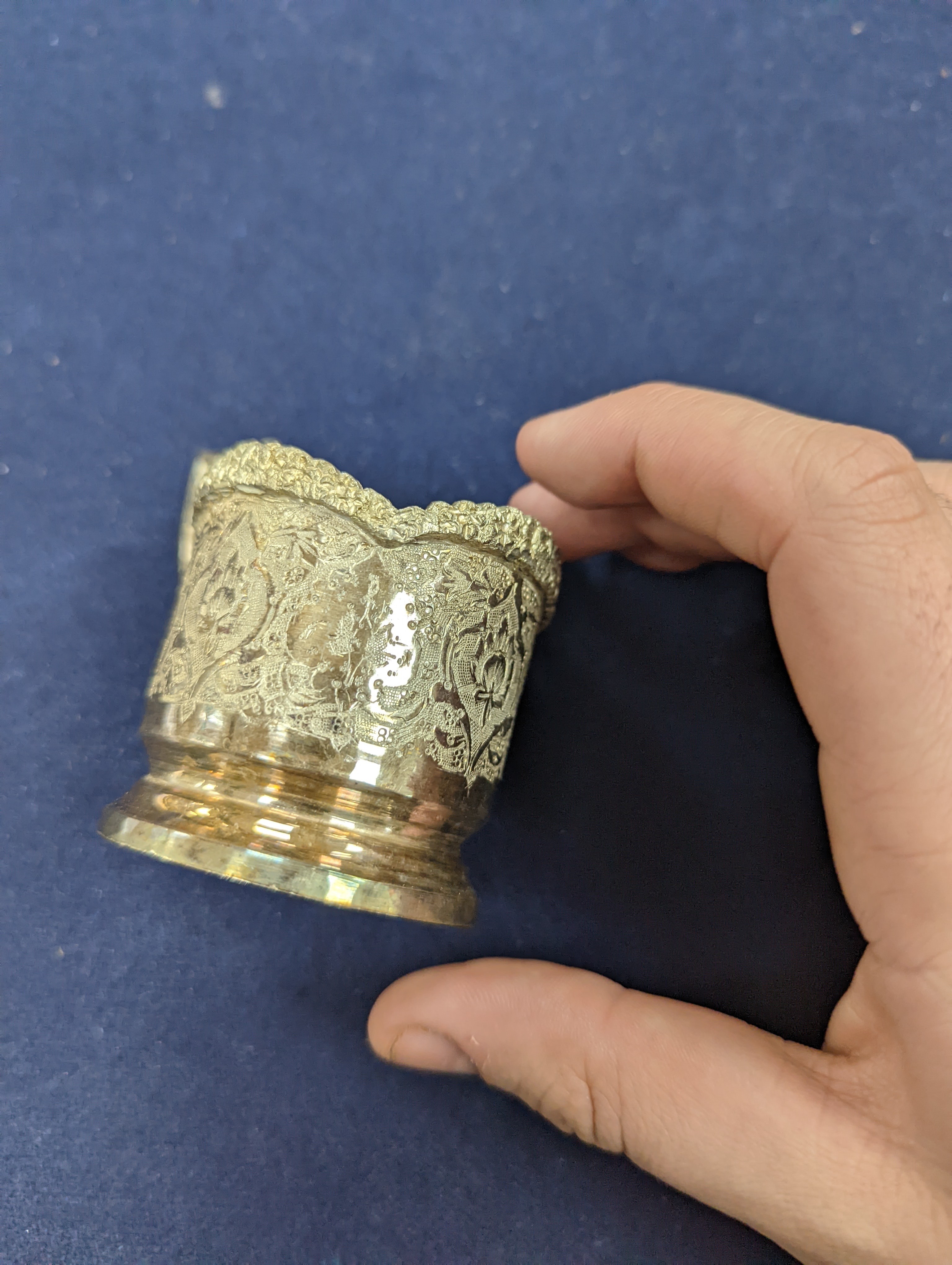 A set of six Persian embossed 84 standard white metal coffee cup holders and matching sugar bowl and cover by Vartan and four other Persian white metal items.